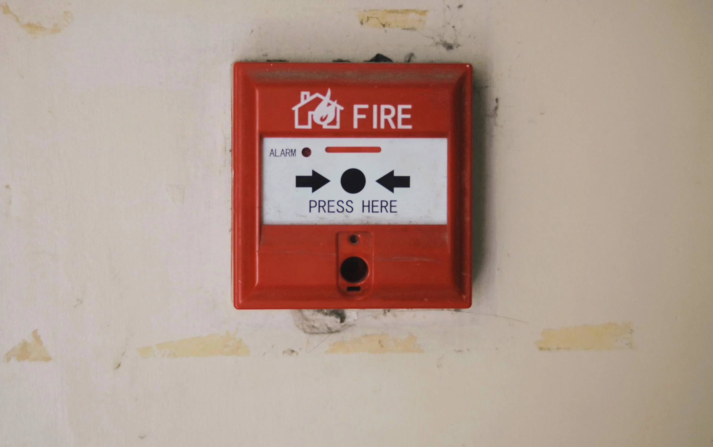 Kistler O'Briend= fire protection aims to educate on the difference between fire prevention and fire protection - a hand-pulled fire alarm mounted on the wall