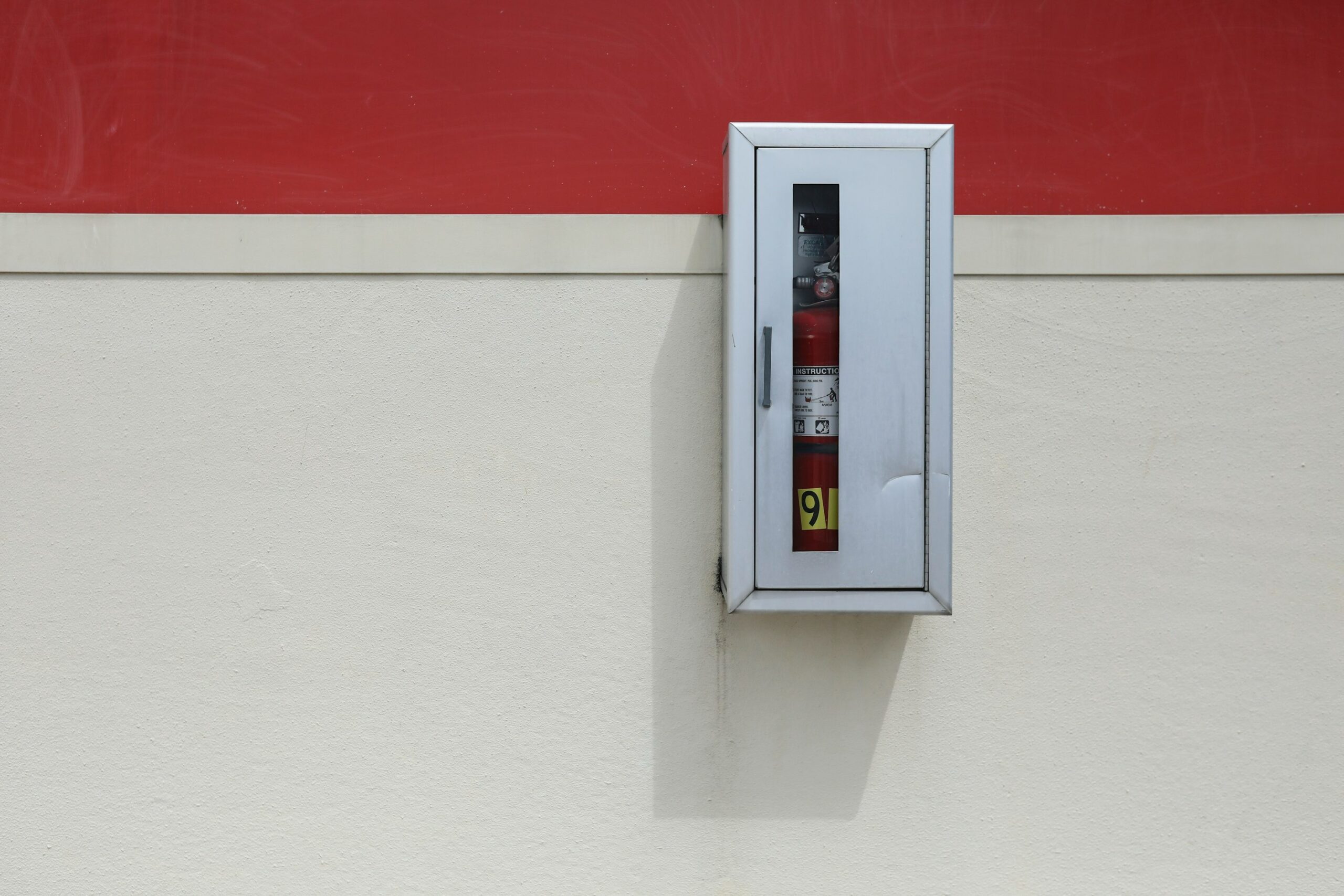 Commercial Fire Extinguisher mounted on wall.