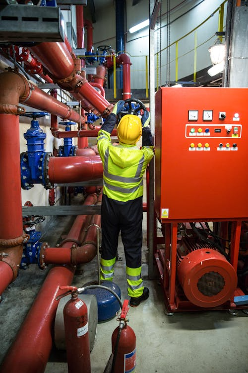 A fire prevention professional working on a fire prevention system